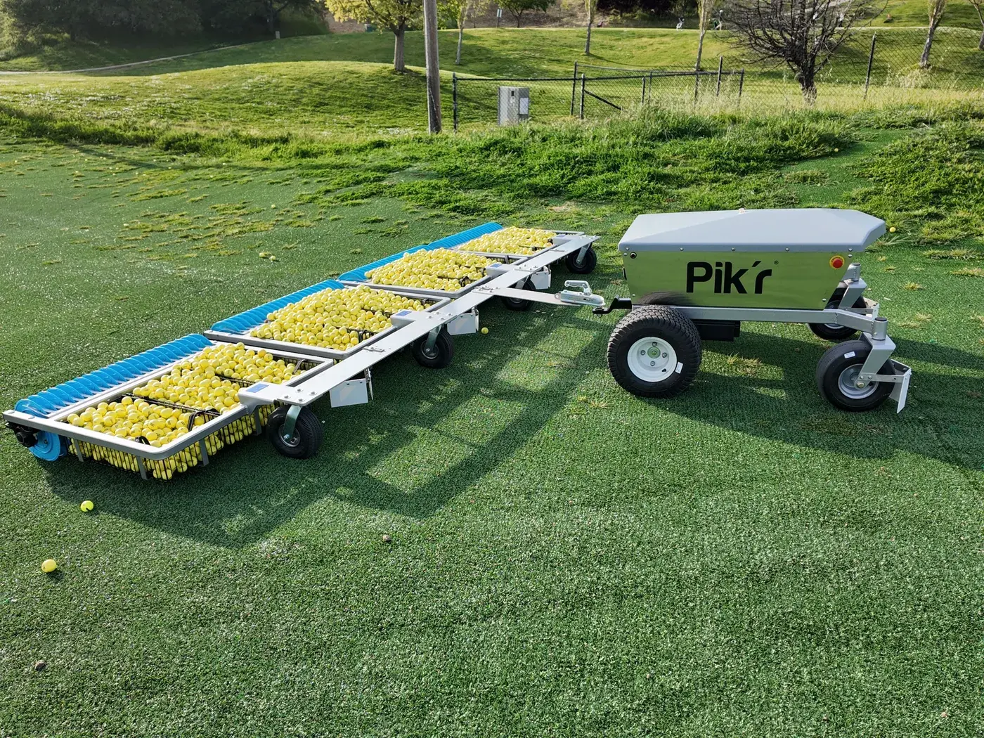 Korechi Pik'r-XL autonomous range-picking robot towing four loaded picker gangs