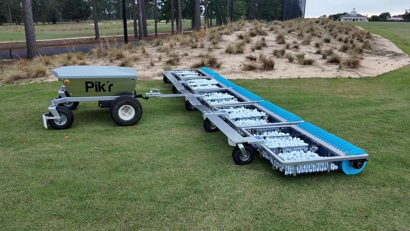 A Korechi Pik'r robot picking golf balls on a driving range